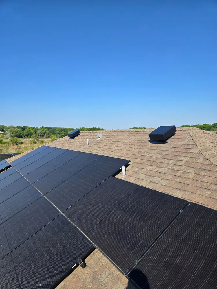 Two solar attic fans working alongside a full rooftop solar array