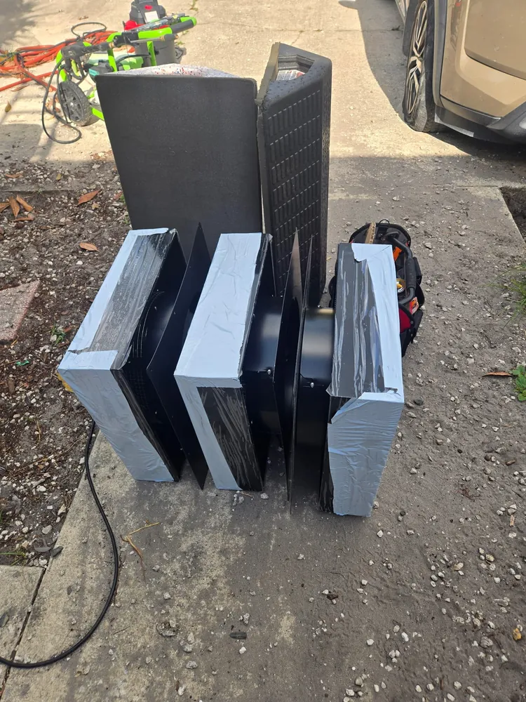 Solar attic fan set near the roof ridge for maximum draw